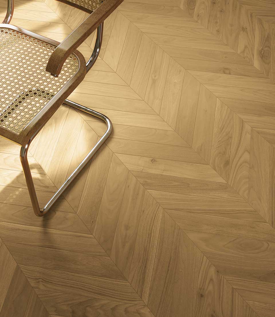 Detail of light wood effect floor plug of with vintage bentwood chair and chrome metal frame.