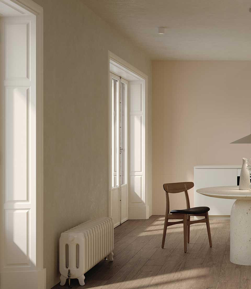 Modern kitchen with wood effect floor, beige and pink wall tiles, round table, wooden chair.